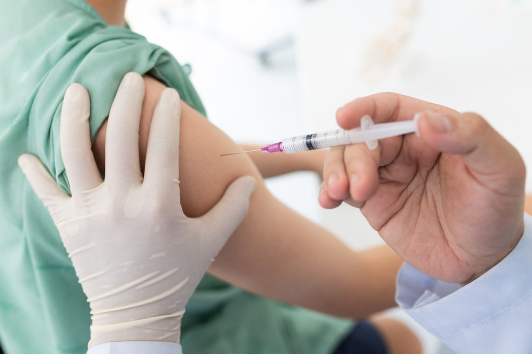 Person being injected with the Covid-19 Vaccine